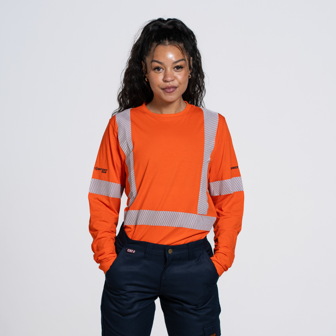MWG SUMMER COMFORT Women's Hi Vis Long Sleeve. Women's Hi Vis Shirt is bright orange with silver reflective striping. Women's Hi Vis Shirt meets CSA Standard for high-visibility.