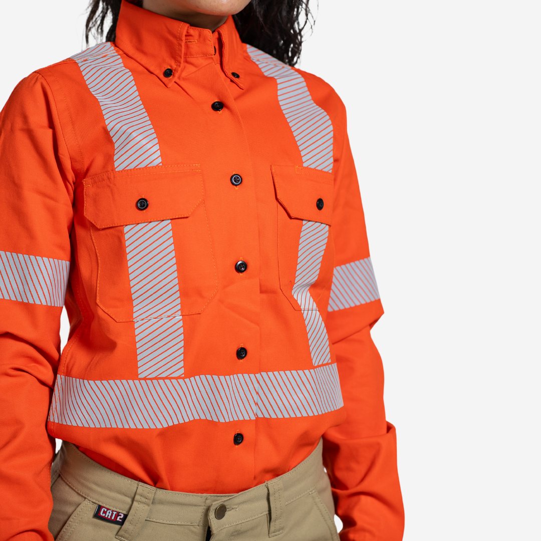 MWG COMFORT WEAVE Women's FR Shirt. Women's FR Shirt is bright orange with silver reflective. Women's FR Shirt is CAT 2 FR.