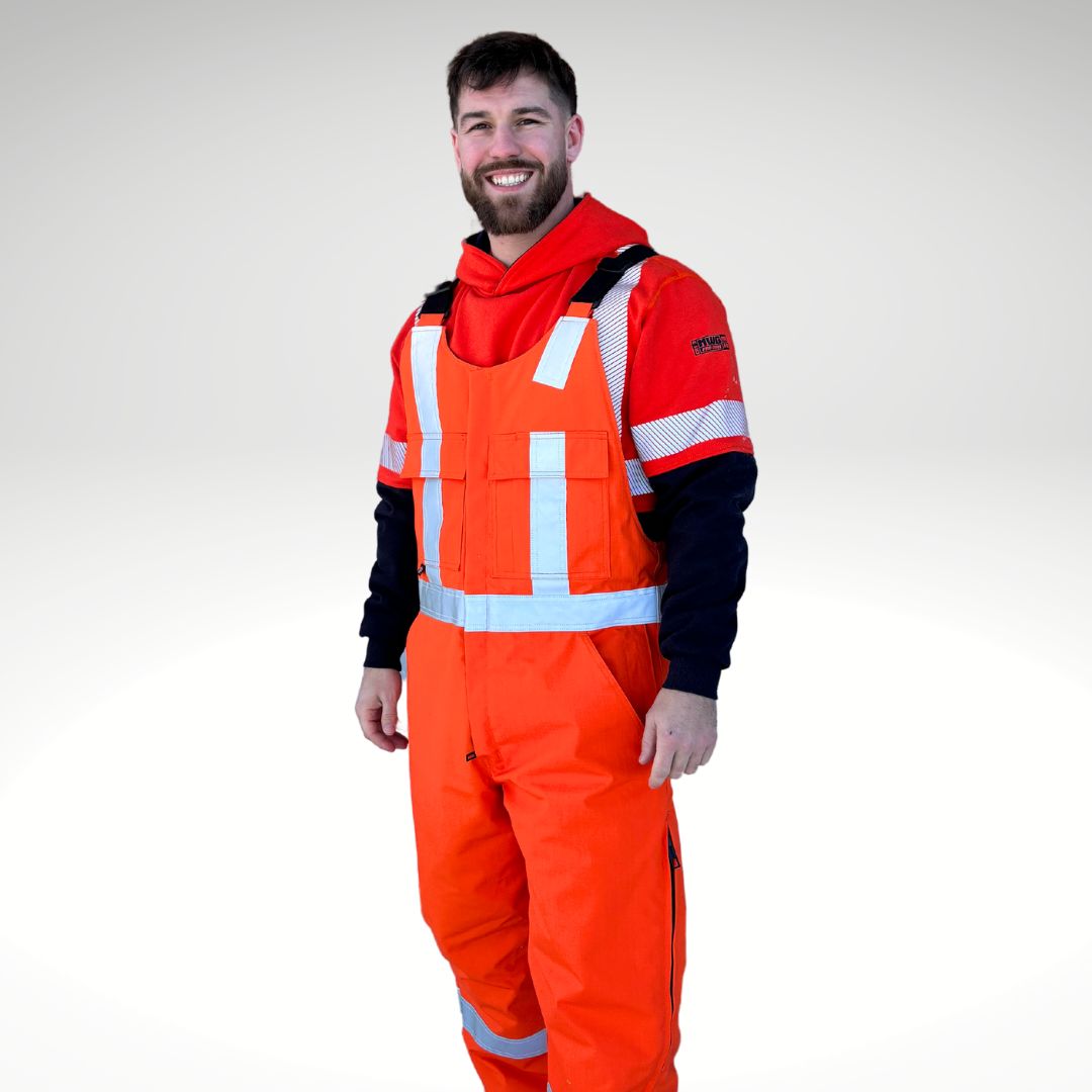 MWG STORMSHIELD Men's FR Insulated Overall. FR Overalls are bright orange with silver reflective for high-visibility. FR Overalls have two large chest pockets and black adjustable shoulder straps. FR Overalls are insulated and made with a windproof fabric for warmth. MWG STORMSHIELD is an inherently flame-resistant ripstop fabric.