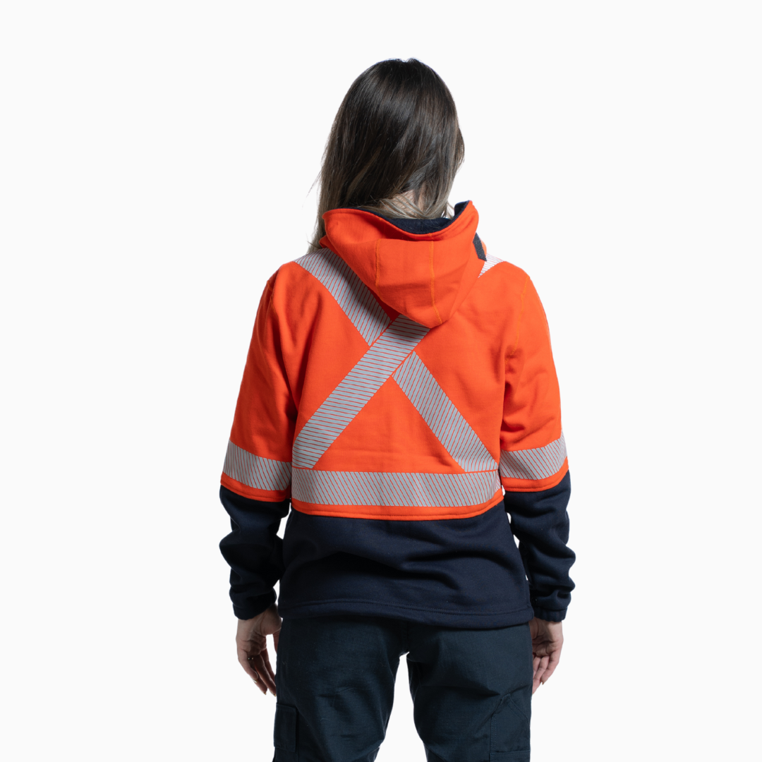 MWG BLOCKER Women's FR Full-Zip Hoodie. Women's FR Hoodie is orange and navy with silver reflective striping. CAT 3 FR.