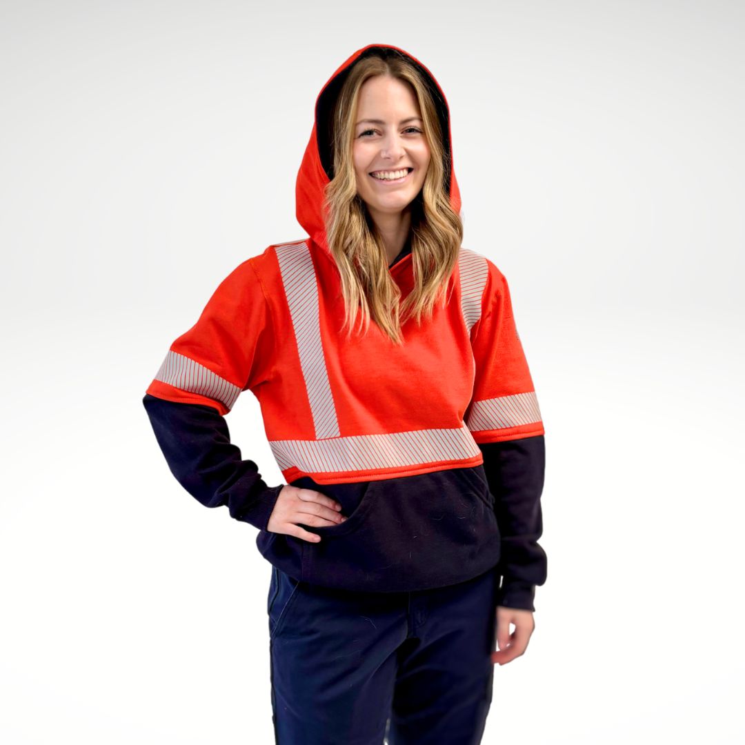 MWG BLOCKER Women's FR Pullover Hoodie. FR Hoodie is bright orange and navy with silver reflective striping on torso and sleeves.