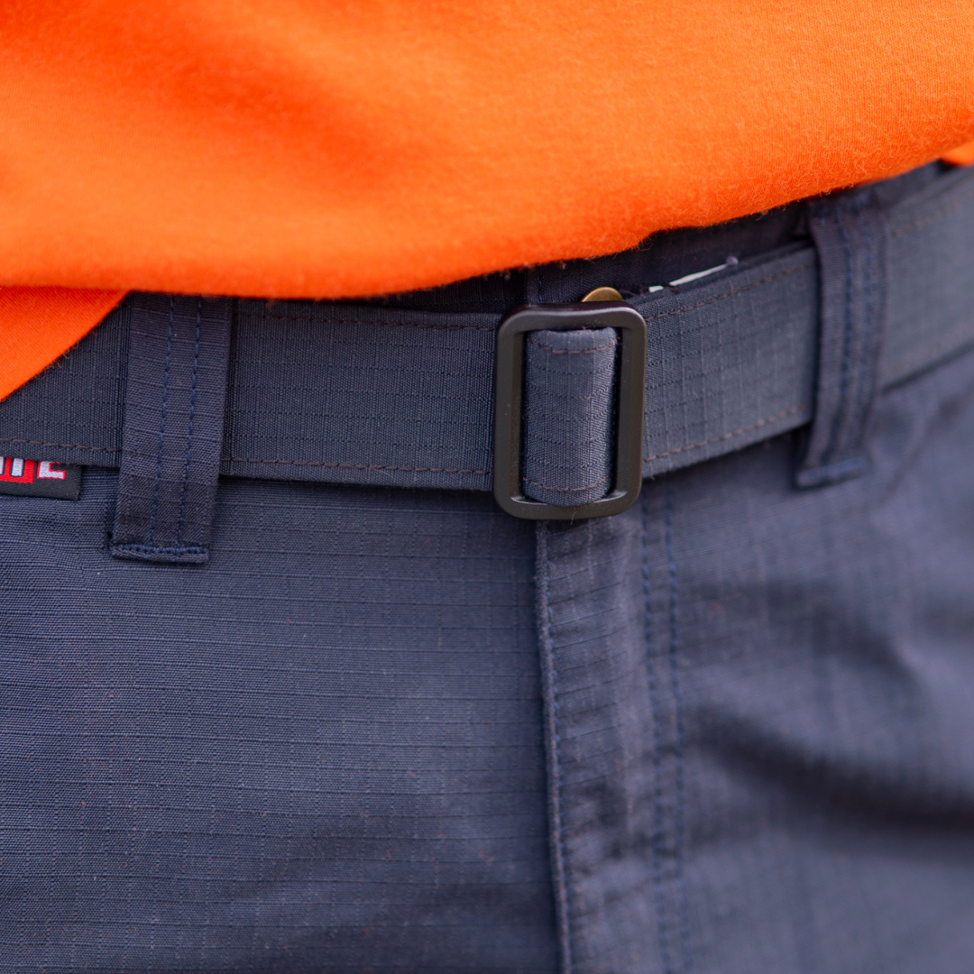 Image of MWG RIPGUARD FR Belt in navy. MWG RIPGUARD is an inherent FR fabric with rip-stop for enhanced durability. MWG RIPGUARD FR belt buckle is black melamine. Image displays CAT 2 identification symbol on MWG RIPGUARD FR Utility Pant, made with the same FR fabric as the belt.