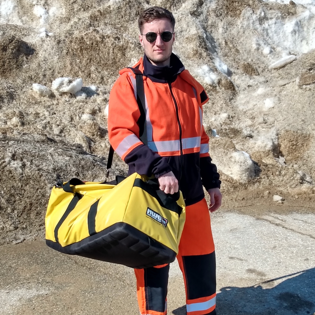 MWG's Big Yellow Duffle Bag. Big Yellow Duffle Bag is made to carry FR clothing and tools to worksite. Bright yellow with black base and black straps.