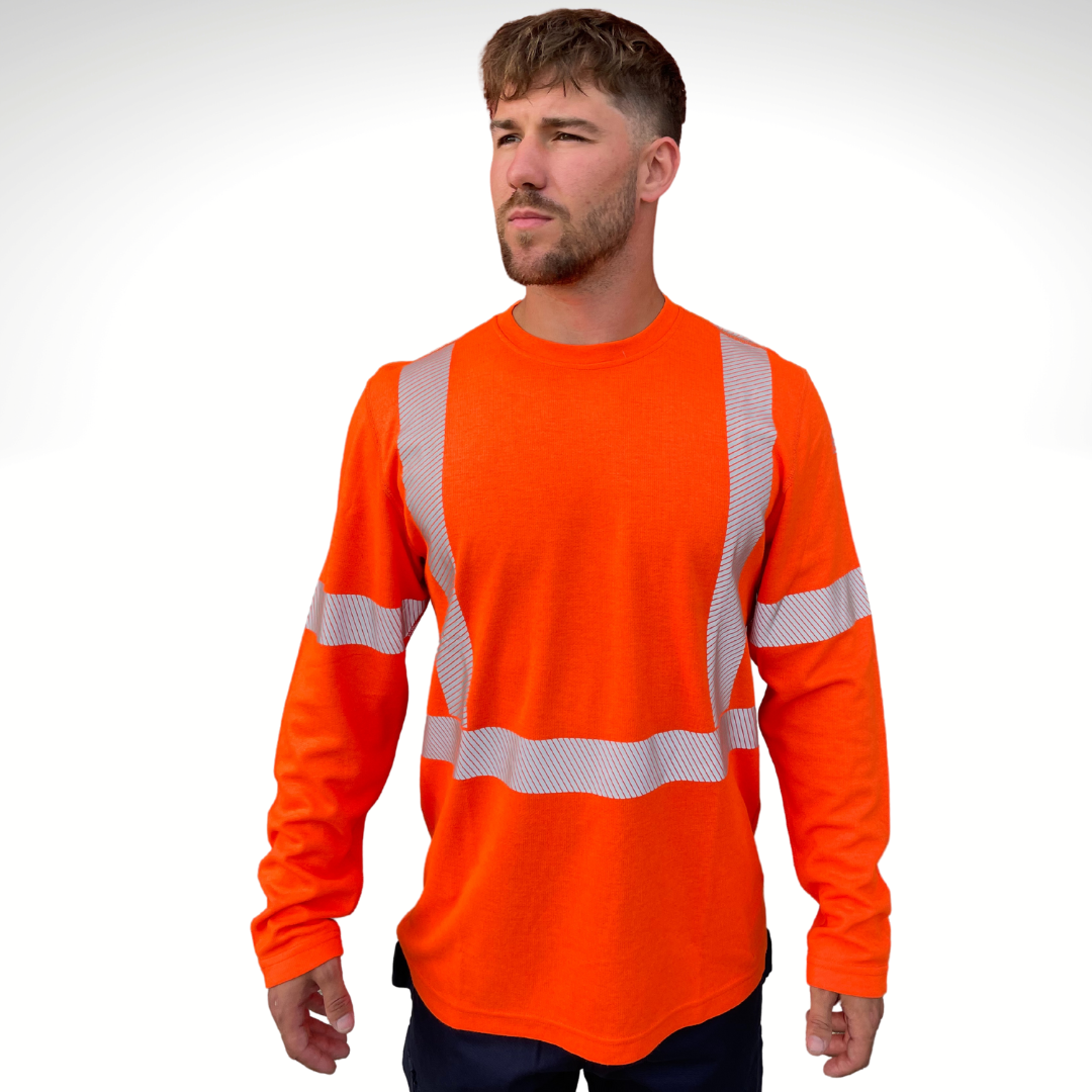 Image of MWG TRANSMISSION FR long-sleeve t-shirt in bright orange. MWG TRANSMISSION FR long-sleeve shirt is made with inherent FR fabric that is bright orange in colour with silver segmented reflective tape to meet CSA Z96-15 high-visibility standard. MWG TRANSMISSION is designed for workers in electrical utilities and mining