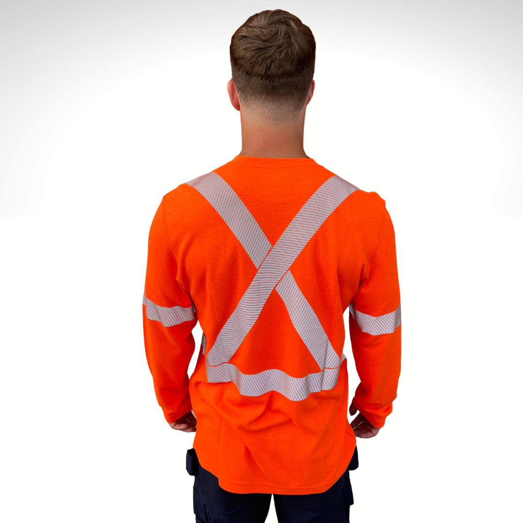 Image of MWG TRANSMISSION FR long-sleeve t-shirt in bright orange. MWG TRANSMISSION FR long-sleeve shirt is made with inherent FR fabric that is bright orange in colour with silver segmented reflective tape to meet CSA Z96-15 high-visibility standard. MWG TRANSMISSION is designed for workers in electrical utilities and mining