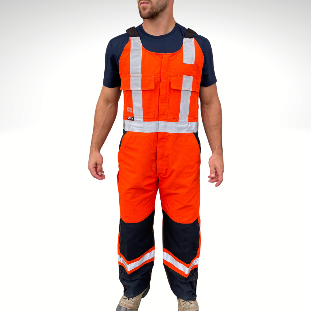 MWG RIPGUARD Men's FR Bib Overall. Men's FR Overall is bright orange and navy with silver reflective striping on torso and legs for high-visibility. FR Overalls have two chest pockets with flaps, two FR leg zippers, and a front FR zipper. FR Overalls have black FR adjustable shoulder straps. FR Overalls are made with MWG RIPGUARD, a flame-resistant ripstop fabric. FR Overalls have a CAT 2 FR rating.