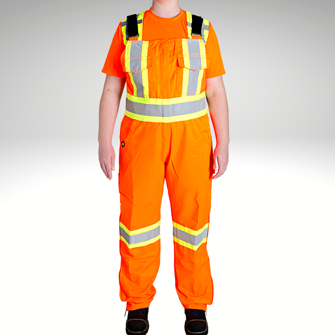 Image of MWG Women's Hi-Vis Unlined Bib Overalls. Women's Hi-Vis Overalls are bright orange in colour with black straps. Yellow/silver/yellow high-visibility reflective tape on torso and legs. Two large chest pockets.