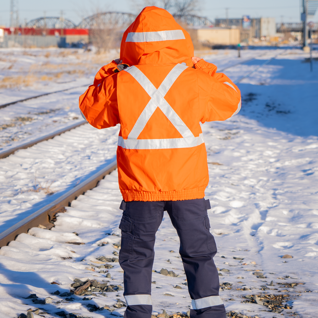 MWG STORMSHIELD Men's FR Bomber Jacket. Men's FR Winter Jacket is bright orange with silver reflective striping on back in an X pattern for high-visibility. Men's FR Winter Jacket is made with MWG STORMSHIELD, an inherently flame-resistant ripstop fabric. Men's FR Jacket can be paired with FR Hoodie and FR Freezer Jacket for additional warmth.