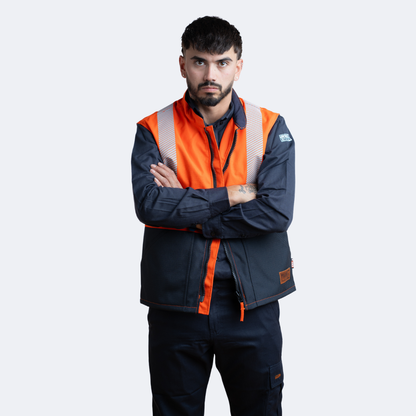 MWG STORMSHIELD Men's FR Vest. Men's FR Vest is orange and navy with silver reflective striping. Men's FR Vest is CAT 2 FR.