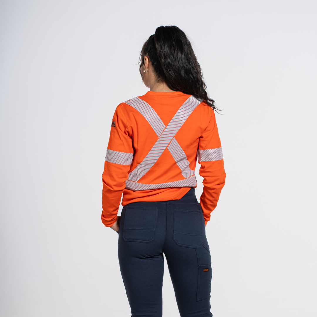 MWG EVOLUTION Women's FR Long Sleeve Shirt. Women's FR Shirt is bright orange with silver reflective striping. Women's FR Shirt is CAT 2 FR.