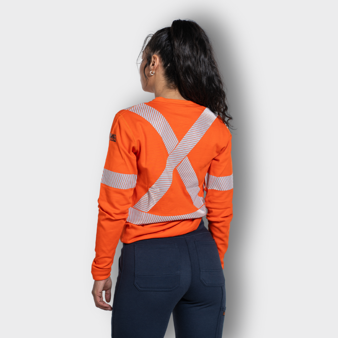 MWG EVOLUTION Women's FR Long Sleeve Shirt. Women's FR Shirt is bright orange with silver reflective striping. Women's FR Shirt is CAT 2 FR.