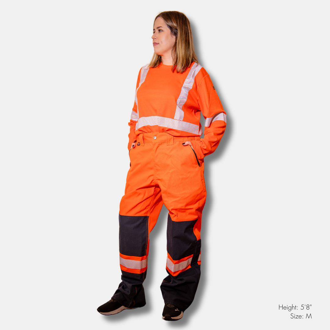 MWG STORMSHIELD Women's FR Rain Pant. Women's FR Rain Pants are bright orange and navy with silver reflective on lower leg.