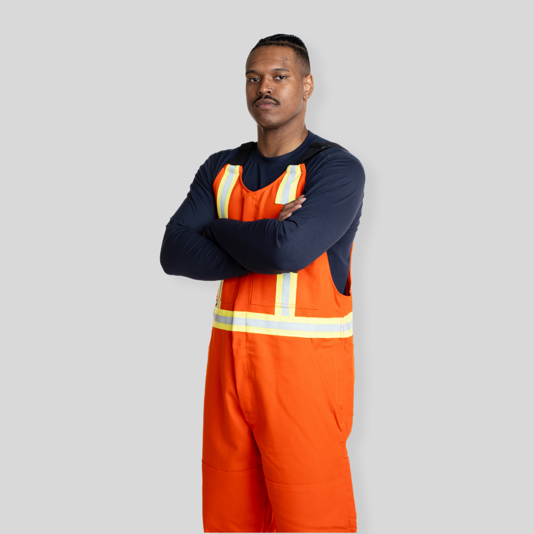 Man wearing orange FR Overalls. FR Overalls made for Welding. Heavyweight FR Canvas.