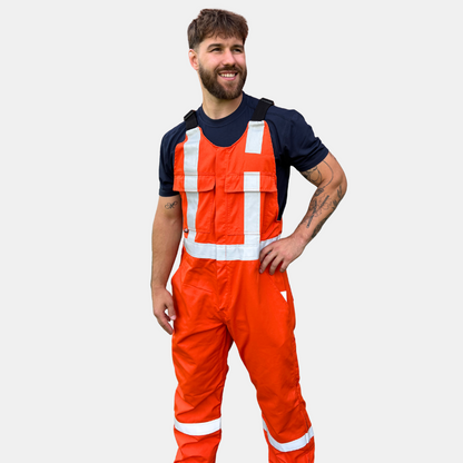 MWG lightweight bib overall. FR Bib Overall is bright orange in colour with silver reflective tape on torso and legs.