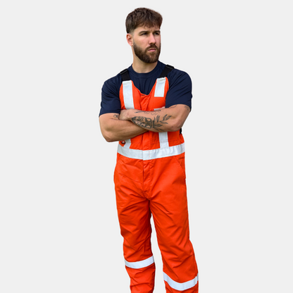 MWG lightweight bib overall. FR Bib Overall is bright orange in colour with silver reflective tape on torso and legs.