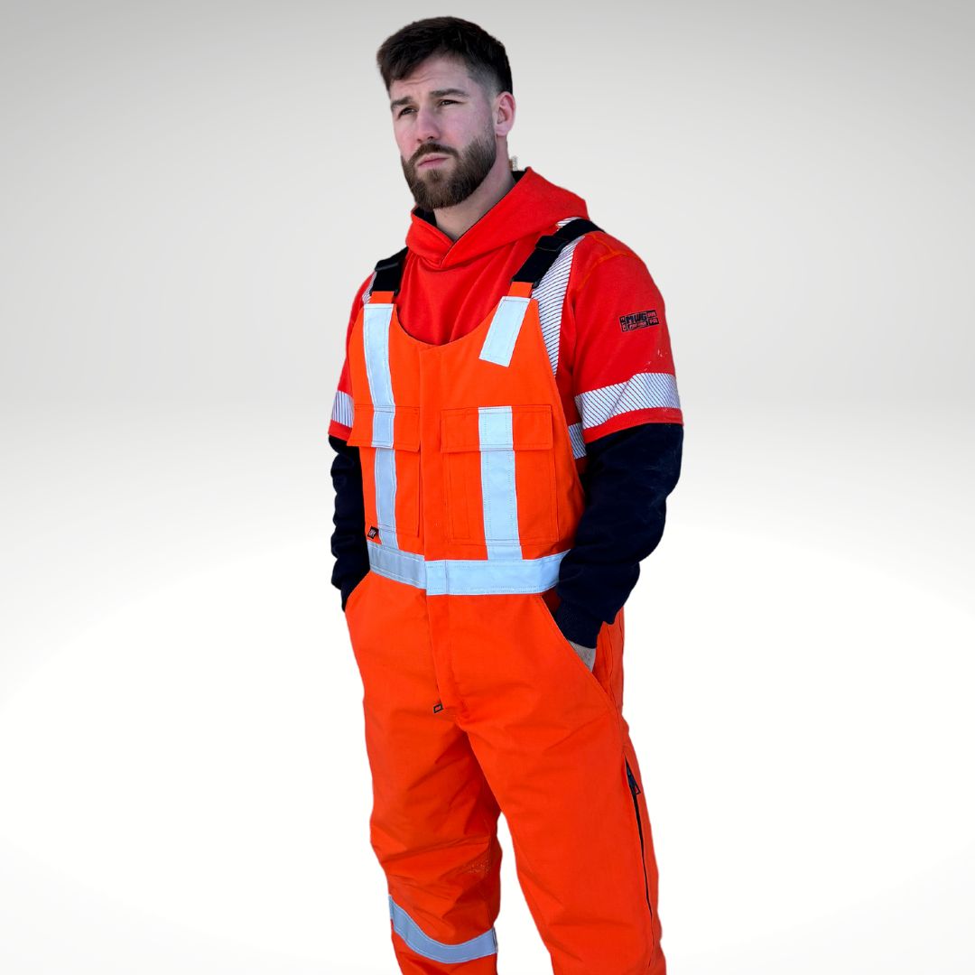 MWG STORMSHIELD Men's FR Insulated Overall. FR Overalls are bright orange with silver reflective for high-visibility. FR Overalls have two large chest pockets and black adjustable shoulder straps. FR Overalls are insulated and made with a windproof fabric for warmth. MWG STORMSHIELD is an inherently flame-resistant ripstop fabric.