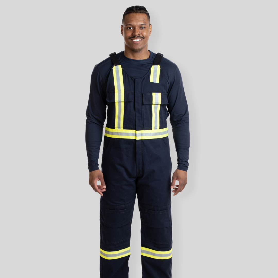 Man wearing navy hi-vis bib overalls from MWG Apparel