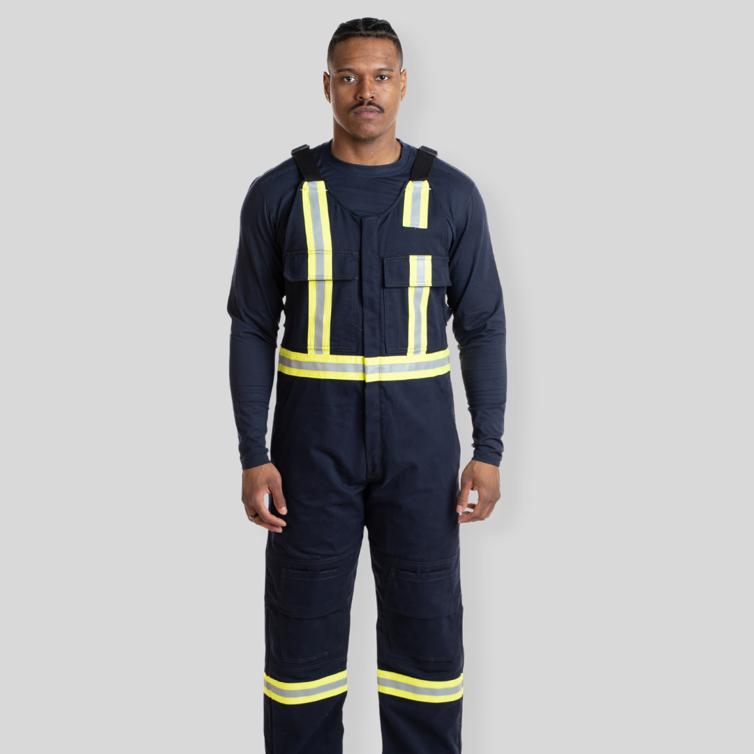 Man wearing navy hi-vis bib overalls from MWG Apparel