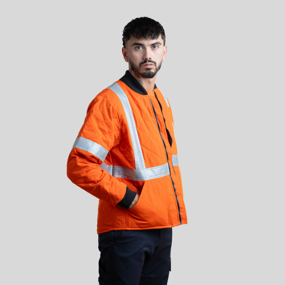 Men's FR Quilted Jacket. Men's FR Jacket is orange with silver reflective. Men's FR Jacket is CAT 4 FR and made with inherently FR fabric.