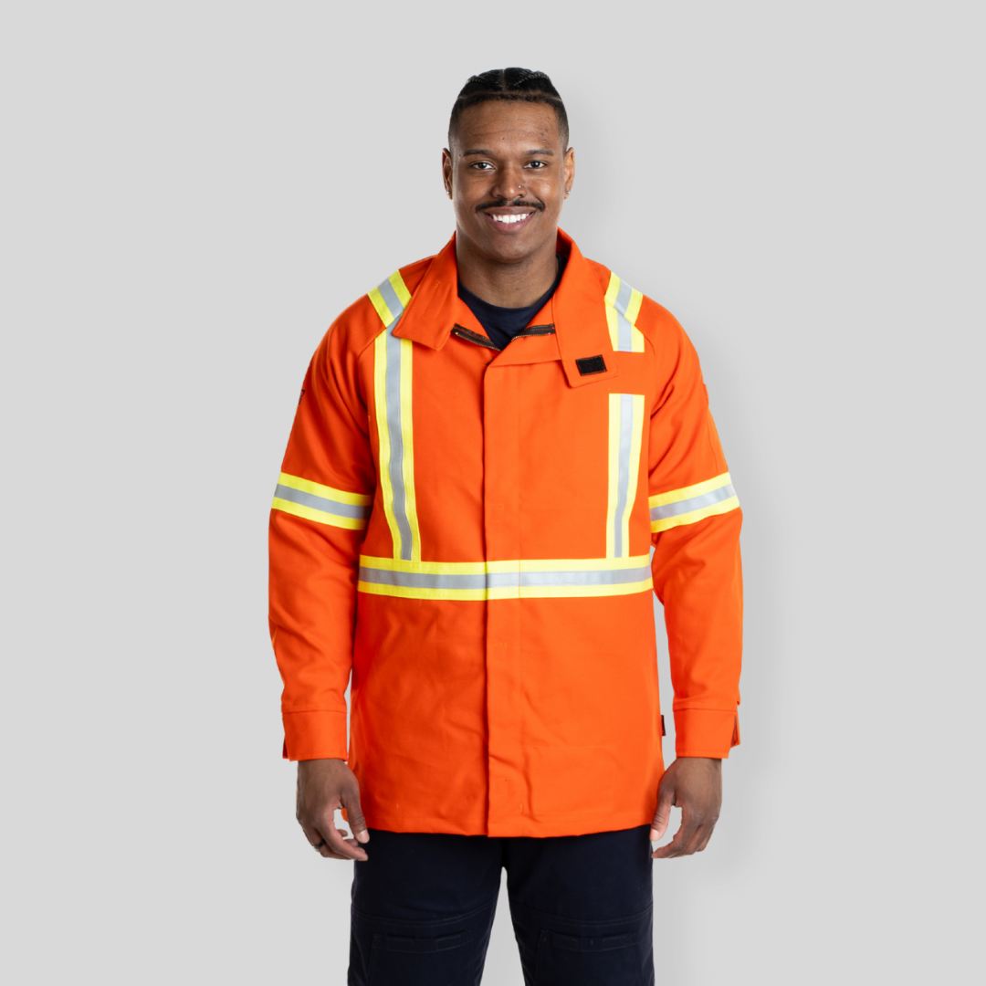 Man wearing FR Welding Jacket. FR Welding Jacket is bright orange with reflective striping for high-visibility.