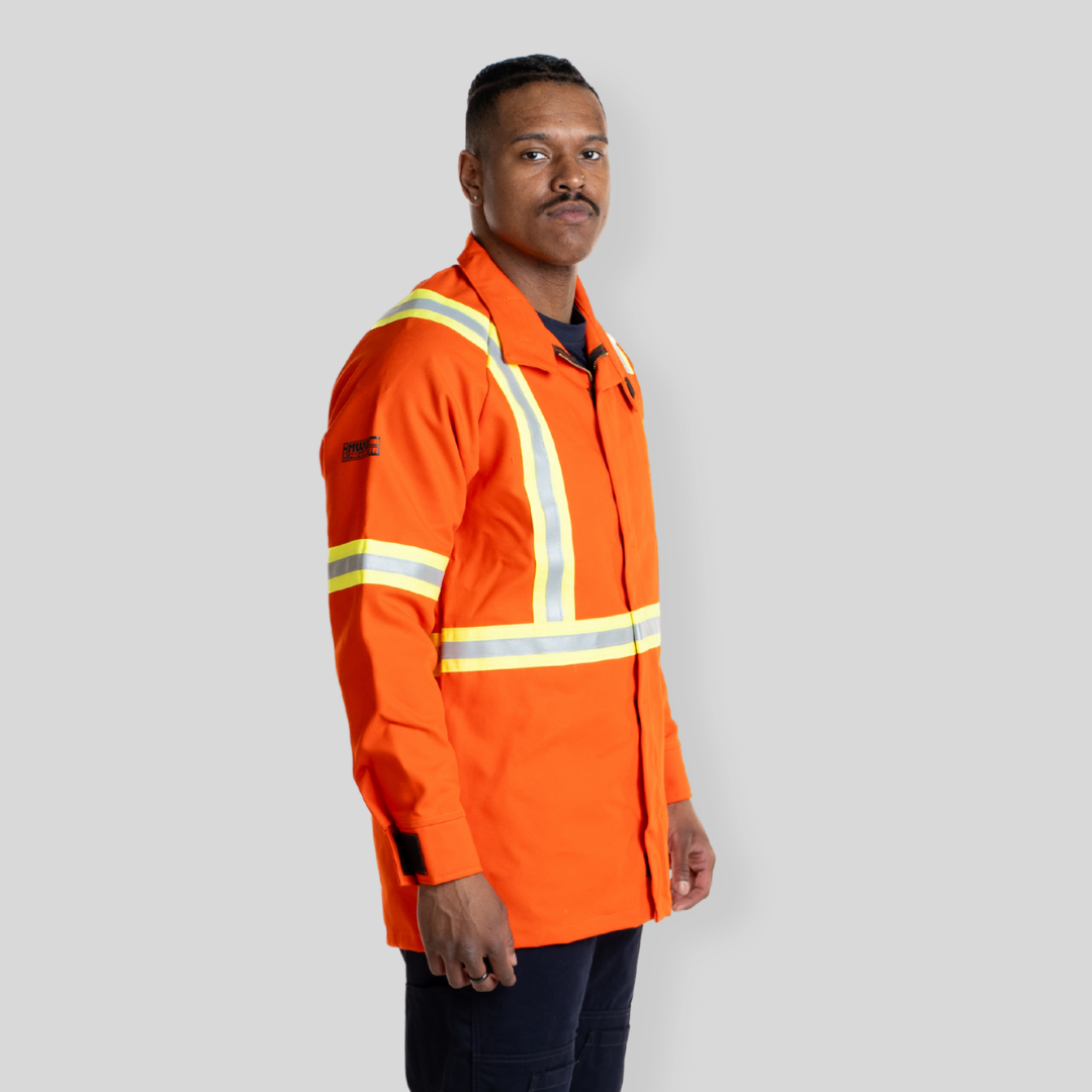Man wearing FR Welding Jacket. FR Welding Jacket is bright orange with reflective striping for high-visibility.