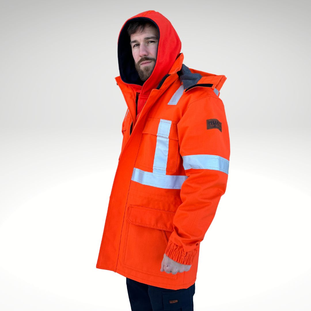 Image of MWG STORMSHIELD FR/AR Parka Jacket. FR Parka is bright orange with silver reflective striping on torso and sleeves for high-visibility. MWG STORMSHIELD is an inherent ripstop fabric for safety and durability. MWG STORMSHIELD is waterproof and windproof for warmth and comfort in cold and wet weather. Men's FR Freezer Jacket zips in for added warmth.