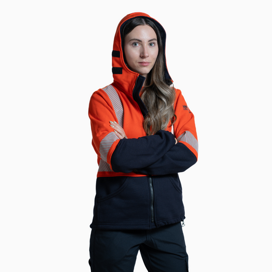 MWG BLOCKER Women's FR Full-Zip Hoodie. Women's FR Hoodie is orange and navy with silver reflective striping. CAT 3 FR.