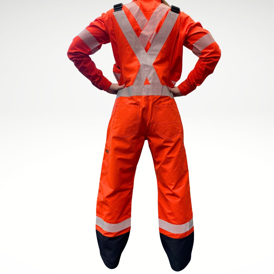MWG RIPGUARD Women's FR Overall. Women's FR Overall is bright orange and navy with silver reflective striping on torso and legs for high-visibility. Women's FR Overalls have black shoulder straps and a black FR Zipper. Women's FR Overall is made with MWG RIPGUARD, an inherently fire-resistant ripstop fabric. Women's FR Overalls are CAT 2 FR.