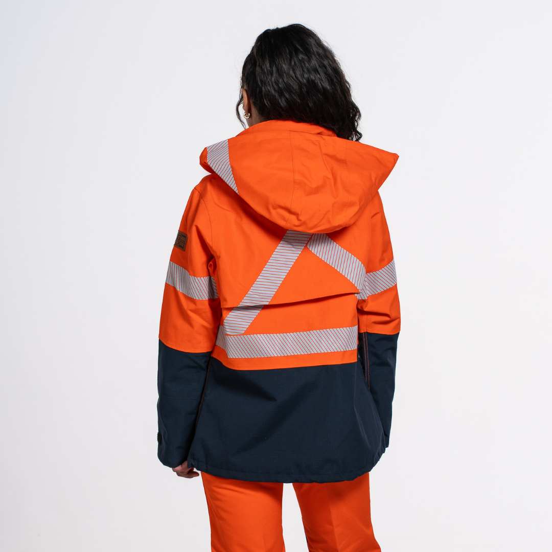MWG STORMSHIELD Women's FR Rain Jacket. Women's FR Rain Jacket is bright orange and navy with silver reflective striping. Women's FR Rain Jacket is CAT 2 FR.