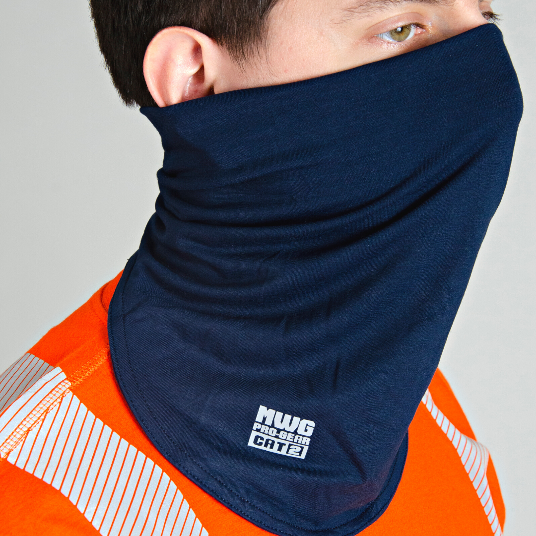 Image of MWG FLEXSAFE FR Neck Gaiter. Flame-resistant (FR) gaiter is navy in colour with silver MWG Pro Gear logo and CAT 2 identification. MWG FLEXSAFE is an inherent flame-resistant fabric. Model is wearing FR gaiter with orange MWG EVOLUTION FR Shirt.