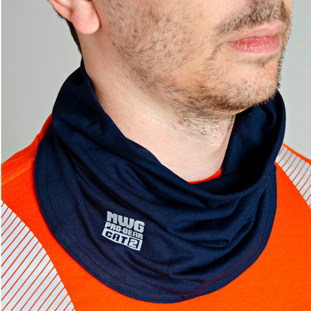 Image of MWG FLEXSAFE FR Neck Gaiter. Flame-resistant (FR) gaiter is navy in colour with silver MWG Pro Gear logo and CAT 2 identification. MWG FLEXSAFE is an inherent flame-resistant fabric. Model is wearing FR gaiter with orange MWG EVOLUTION FR Shirt.
