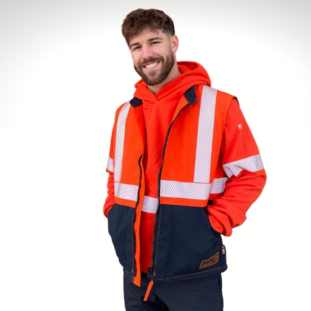 MWG STORMSHIELD Men's FR Vest. FR Vest is bright orange and navy with silver segmented reflective striping on torso for high-visibility. Men's FR Vest has a black FR zipper with an orange pull tab. FR Vest is made with waterproof and windproof FR fabric. FR Vest has a CAT 2 FR rating.