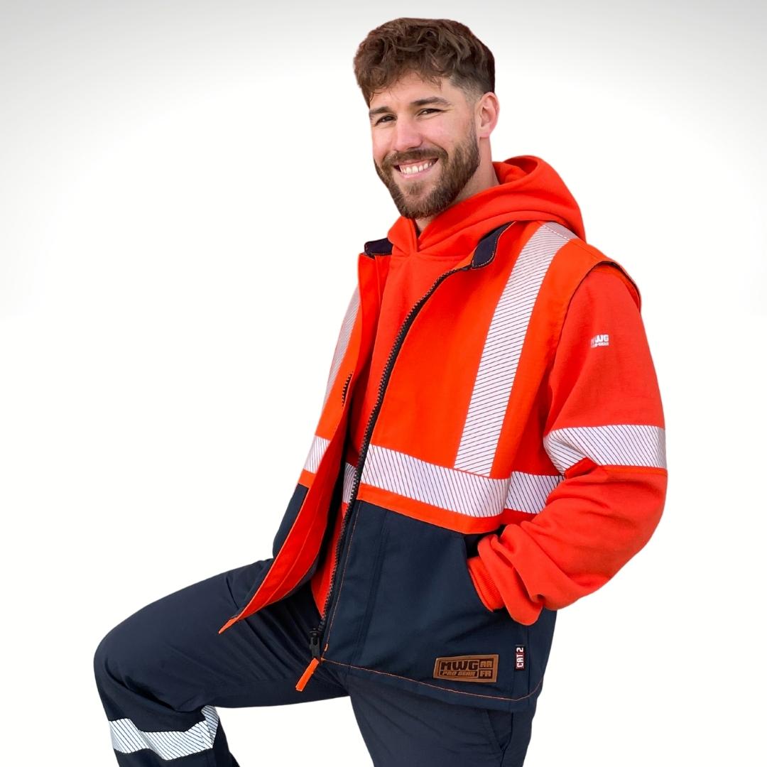 MWG STORMSHIELD Men's FR Vest. FR Vest is orange and navy with silver segmented reflective striping on torso for high-visibility. Men's FR Vest is wind and waterproof with a ripstop finish. Men's FR Vest is designed to be worn over a hoodie - as pictured.