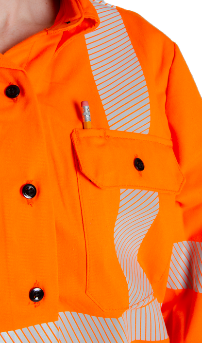 Image of pencil pocket in MWG COMFORT WEAVE FR button shirt. Pencil slides in above right chest pocket. FRC Shirt is bright orange in colour with silver segmented reflective tape. MWG COMFORT WEAVE is a lightweight inherent FR fabric.