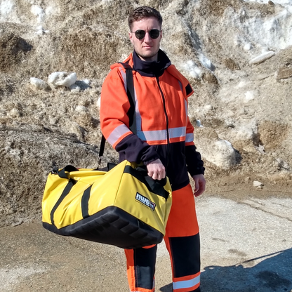 MWG's Big Yellow Duffle Bag. Big Yellow Duffle Bag is made to carry FR clothing and tools to worksite. Bright yellow with black base and black straps.