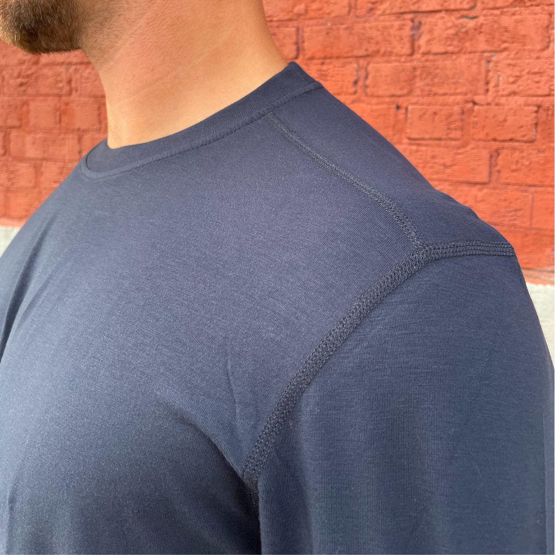 MWG FLEXSAFE Men's FR Base Layer T-Shirt. Men's FR Base Layer is navy with flat lock seams. Men's FR T-Shirt is 4 way stretch, wicks moisture, and breathable. Men's FR T-Shirt has a CAT 1 FR rating.