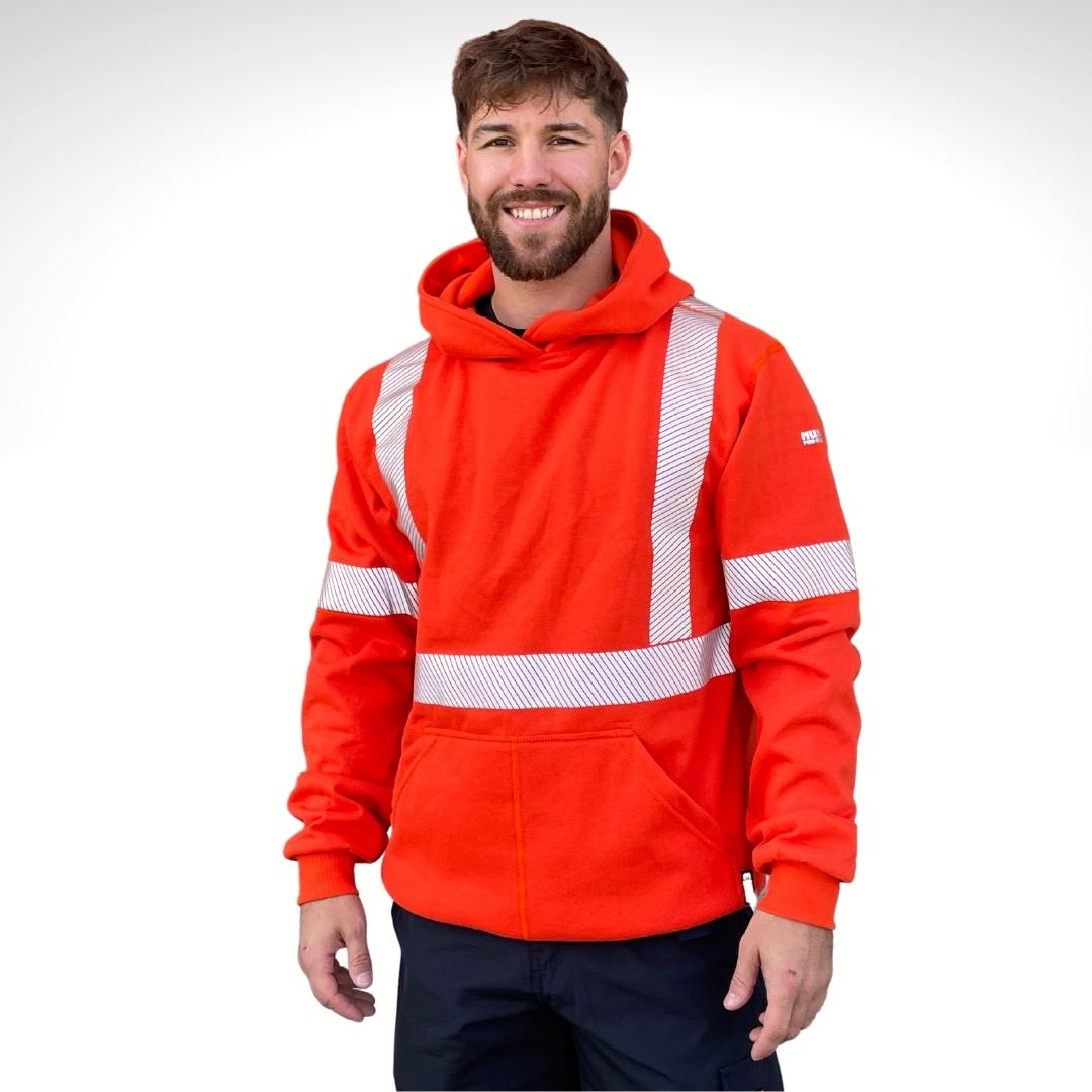 MWG BLOCKER Men's FR Pullover Hoodie. Men's FR Hoodie is bright orange with silver segmented reflective striping on torso and sleeves. FR Hoodie has a large muff pocket in front and flat seams. FR Hoodie has ribbed cuffs and waist band. Men's FR Hoodie is made with MWG BLOCKER, an inherently flame-resistant fleece. Men's FR Hoodie is made in Canada. FR Hoodie has a CAT 3 FR rating.