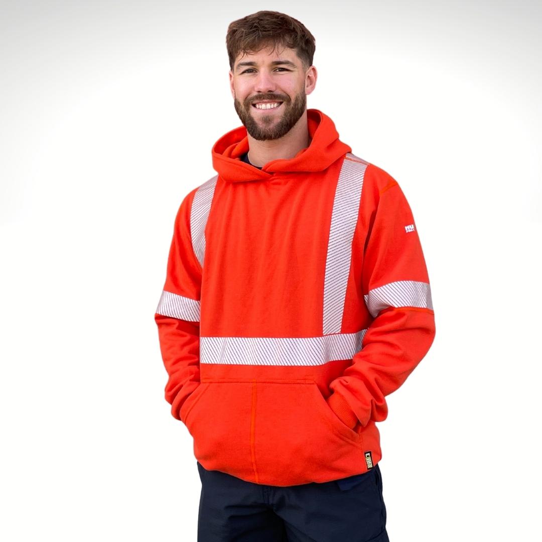 MWG BLOCKER Men's FR Pullover Hoodie. Men's FR Hoodie is bright orange with silver segmented reflective striping on torso and sleeves for high-visibility. Men's FR Hoodie has a large front pocket and flat seams. FR Hoodie is made with MWG BLOCKER, an inherently flame-resistant heavyweight fleece. FR Hoodie is made in Canada. Layers comfortably with FR Jackets.