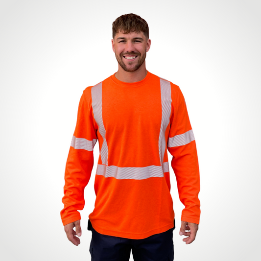 Image of MWG TRANSMISSION FR long-sleeve t-shirt in bright orange. MWG TRANSMISSION FR long-sleeve shirt is made with inherent FR fabric that is bright orange in colour with silver segmented reflective tape to meet CSA Z96-15 high-visibility standard. MWG TRANSMISSION is designed for workers in electrical utilities and mining