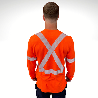Image of MWG TRANSMISSION FR long-sleeve t-shirt in bright orange. MWG TRANSMISSION FR long-sleeve shirt is made with inherent FR fabric that is bright orange in colour with silver segmented reflective tape to meet CSA Z96-15 high-visibility standard. MWG TRANSMISSION is designed for workers in electrical utilities and mining