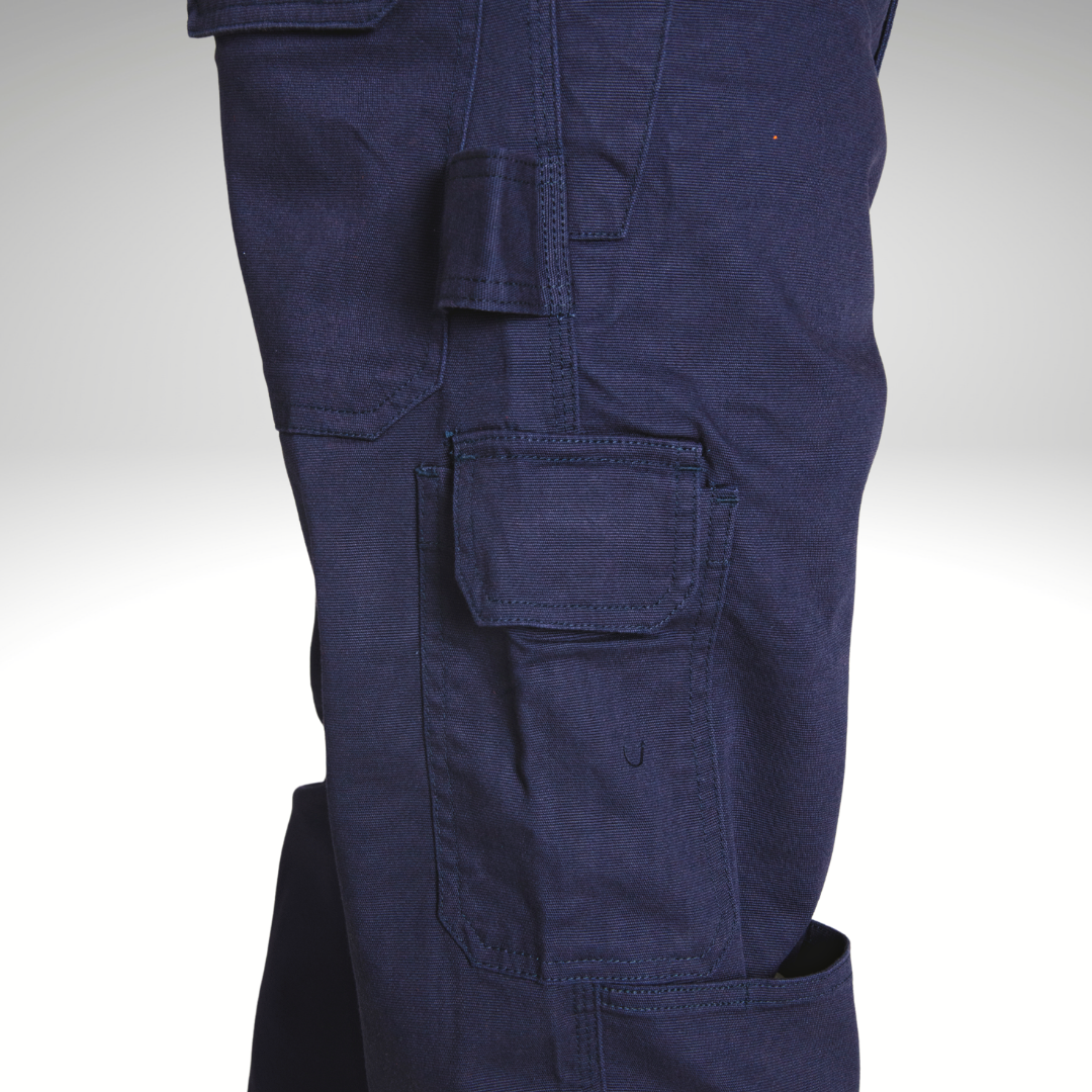 View of the right side of the MWG FLEXGUARD FR Utility Pant. Image displays large cargo pocket, tool loop, large back pocket, and knee pad slot. FR Pant is navy in colour. MWG FLEXGUARD is a treated stretch canvas FR fabric.