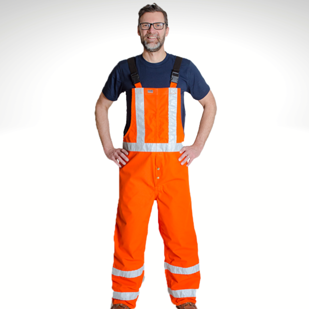 Image of MWG FR rain resistant overall with higher front and back. Rain Bib is inherently flame-resistant (FR) and bright orange in colour. Overall includes silver reflective striping to meet high-visibility standard CSA Z96-15. MWG FR Rain Overalls are made from an inherent flame-resistant (FR) fabric.
