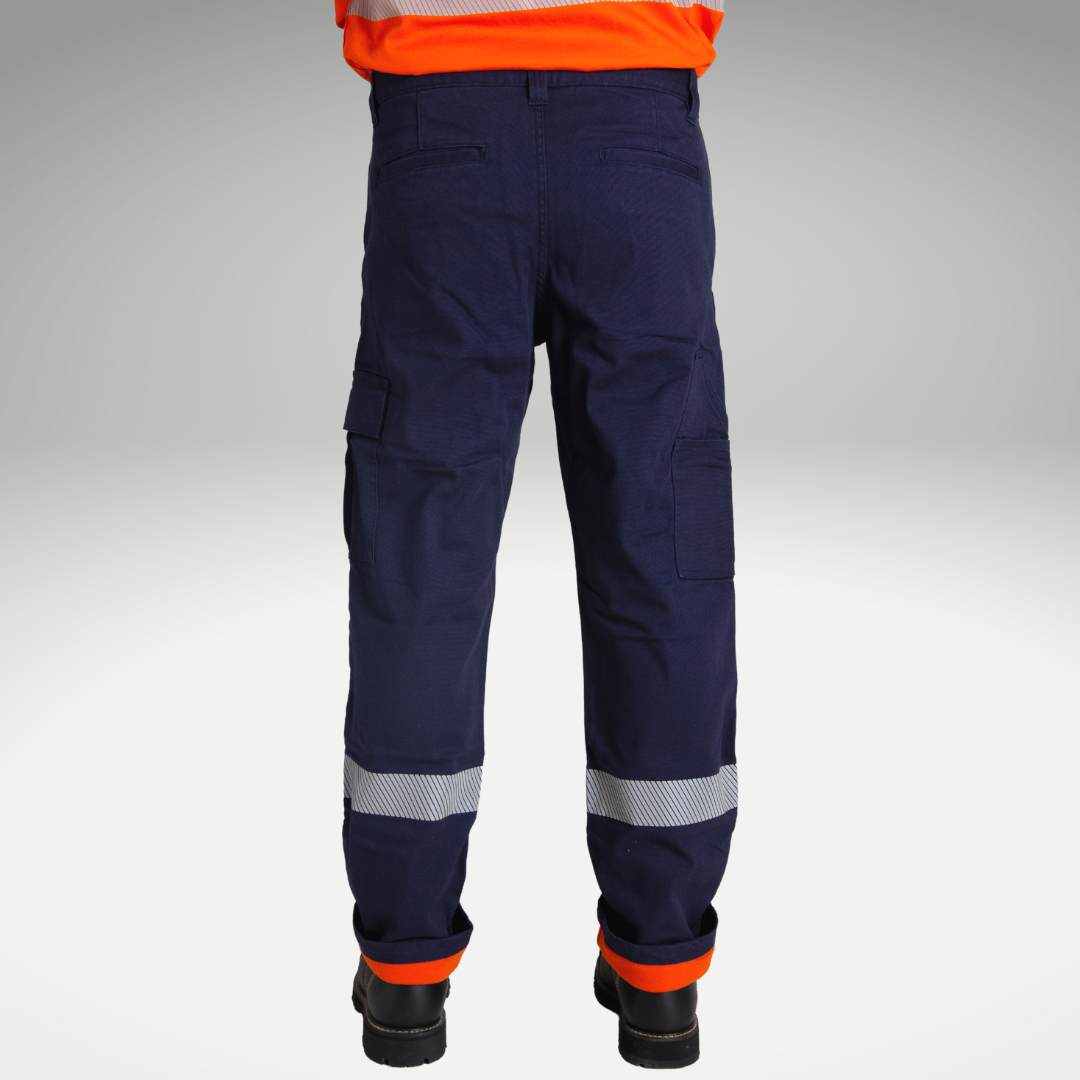 Back view of MWG FLEXGUARD FR//AR Lined Stretch Canvas Utility Pant. Lined FR Stretch Pant is navy in colour with silver segmented reflective tape for high-visibility. Navy FR Pant has orange lining for warmth in the winter. MWG FLEXGUARD is a flame-resistant canvas.