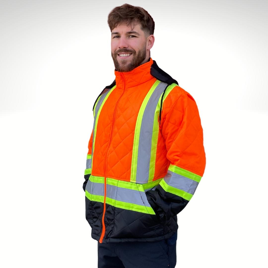 Men's Hi-Vis Freezer Jacket. Hi-Vis Freezer Jacket is bright orange and black with yellow/silver/yellow reflective striping on torso and sleeves for hi-vis compliance. Hi-Vis Freezer Jacket has a black hood and black drawstrings. Hi-Vis Freezer Jacket has an orange zipper and two pockets on low hip.