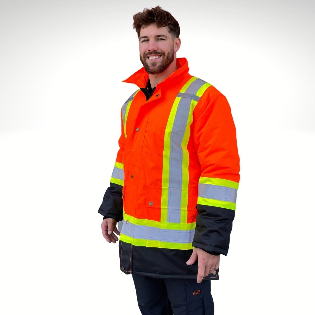 Men's Hi-Vis Winter Jacket. Hi-Vis Winter Jacket is bright orange and black with yellow/silver/yellow reflective striping on torso and sleeves for high-visibility. Men's Hi-Vis Winter Jacket has copper snap buttons and two large pockets on front. Hi-Vis Winter Jacket has radio clips on each shoulder and a detachable hood for safety. Hi-Vis Winter Jacket is a 3-in-1 system with a hi-vis inner liner. Hi-Vis Jackets zip into one another.