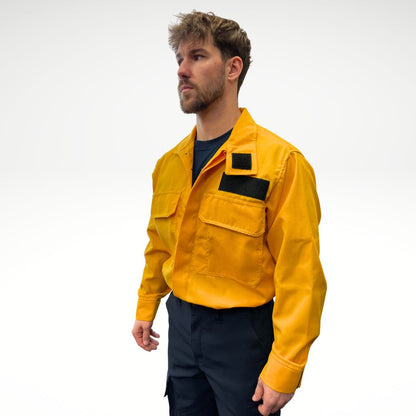 Men's FR Shirt. Bright yellow with black buttons and velcro. Made for wildland forest firefighting.