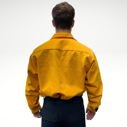 Men's FR Shirt. Bright yellow with black buttons and velcro. Made for wildland forest firefighting.