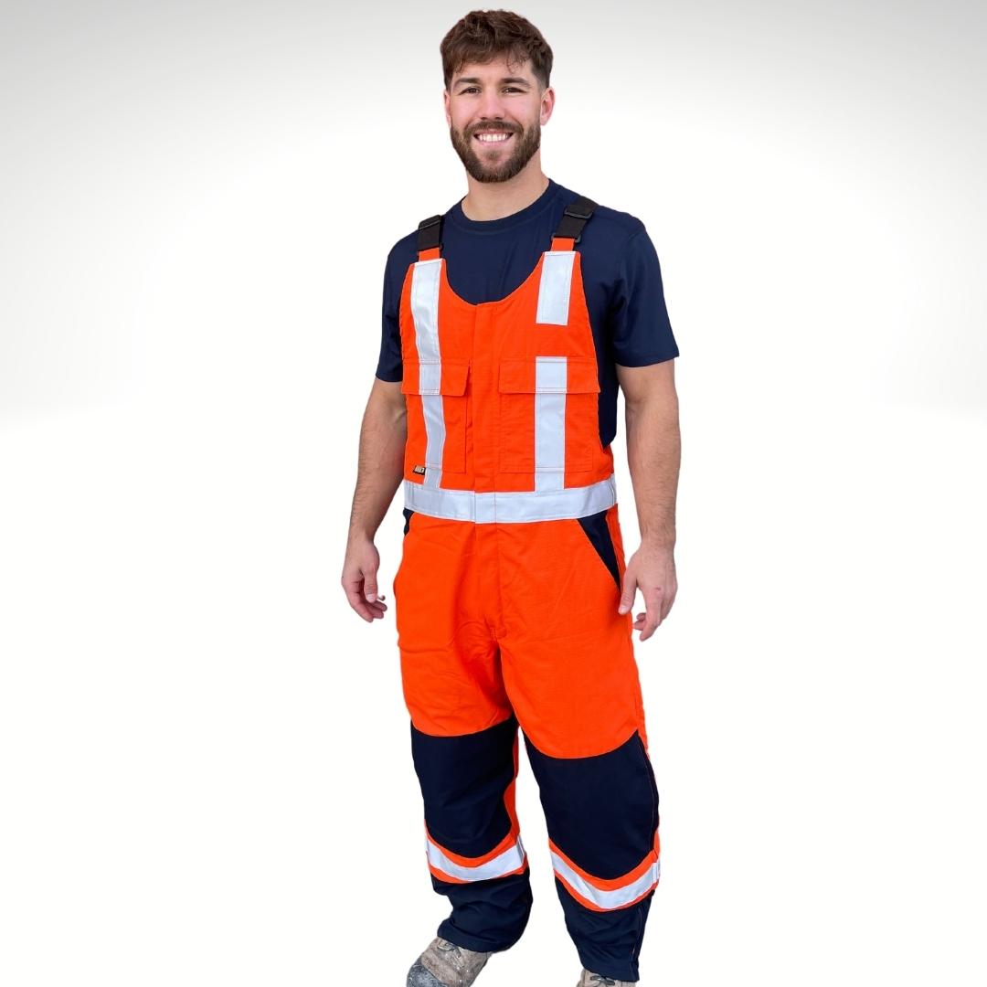 MWG RIPGUARD Men's FR Knit-Lined Overall. Men's FR Overalls are bright orange and navy with silver reflective striping on torso and legs for high-visibility. Men's FR Overall has two large pockets on chest with flaps. Men's FR Bib Overall has navy knees and pockets. FR Overalls have a knit-lining for warmth in cold weather. FR Overalls are made with a flame-resistant ripstop fabric.