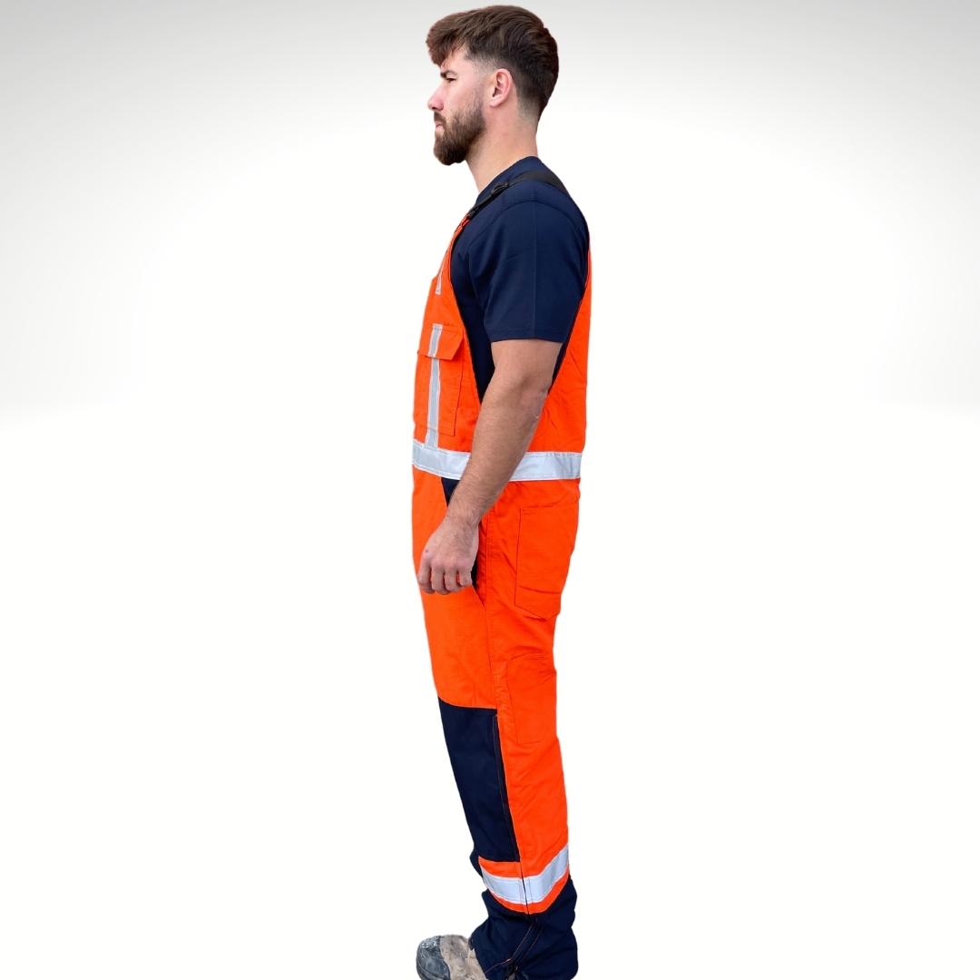 MWG RIPGUARD Knit-Lined Men's FR Overalls. FR Overalls are bright orange and navy with silver reflective striping on torso and legs for high-visibility. Men's FR Overalls have a black FR zipper on each leg for easy change. FR Overalls are made with an inherently flame-resistant ripstop fabric. FR Overalls have a knit-lining for warmth in cool weather.