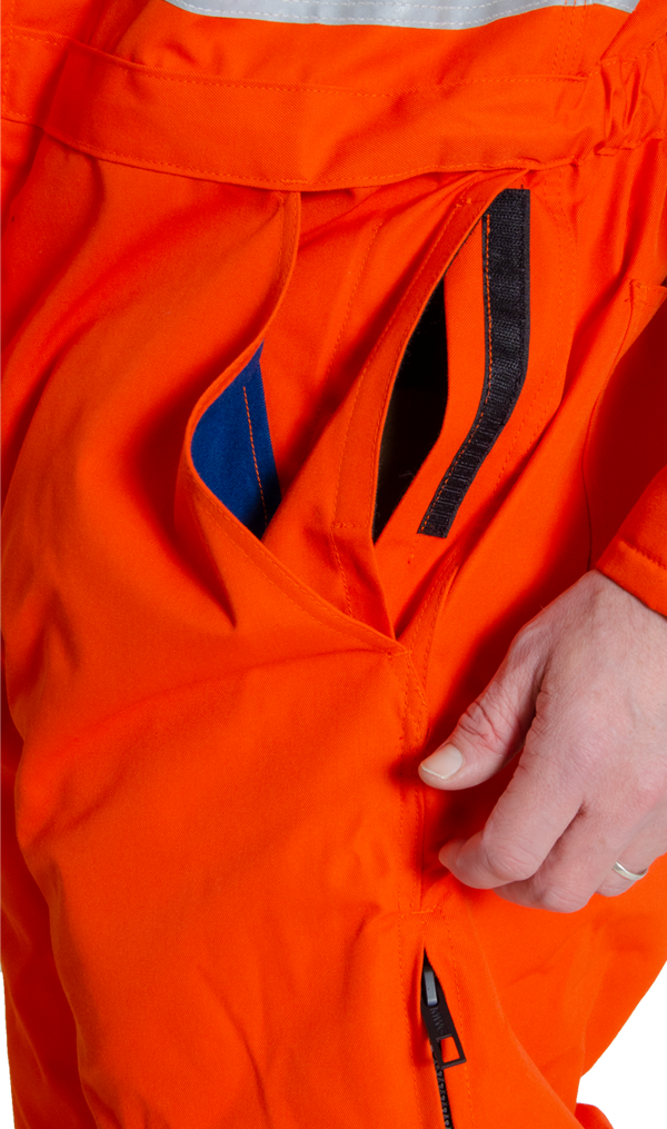 Image of double pocket found in MWG FRC coverall. Includes velcro closure to keep items secure. MWG Coverall is made with inherent flame-resistant (FR) fabric.